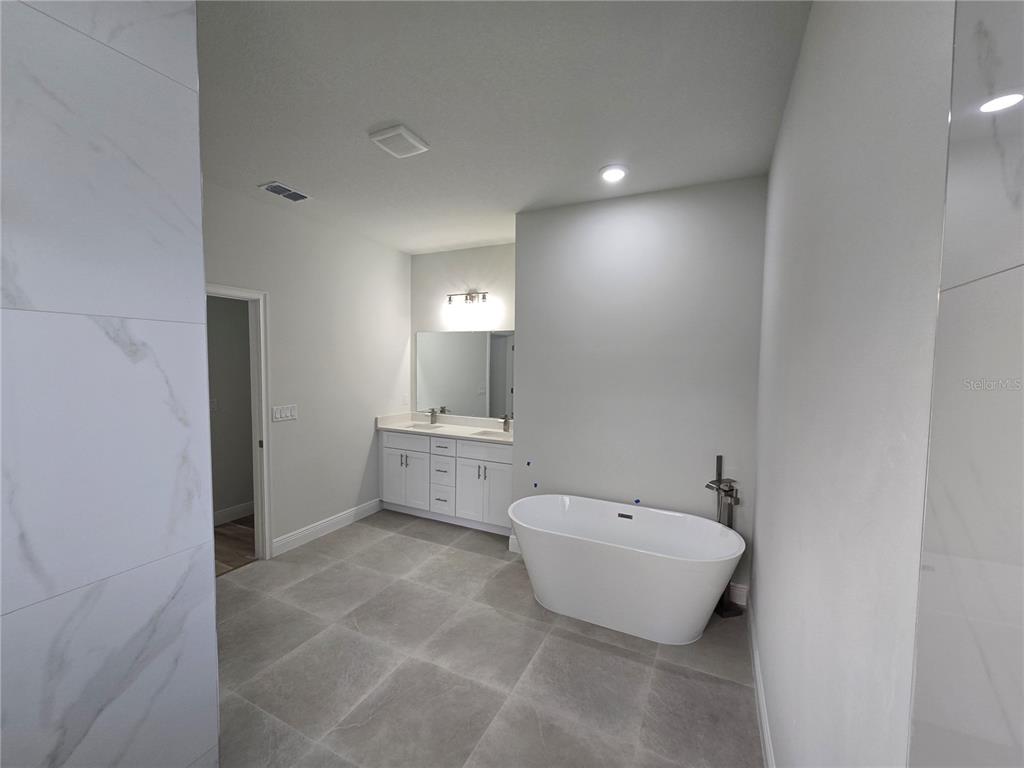 2717 Southwest 140th Loop Ocala, FL 34473 - Photo 24 of 40 a bathroom with a toilet sink and mirror