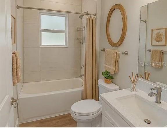 2717 Southwest 140th Loop Ocala, FL 34473 - Photo 26 of 40 a bathroom with a sink a toilet and a mirror