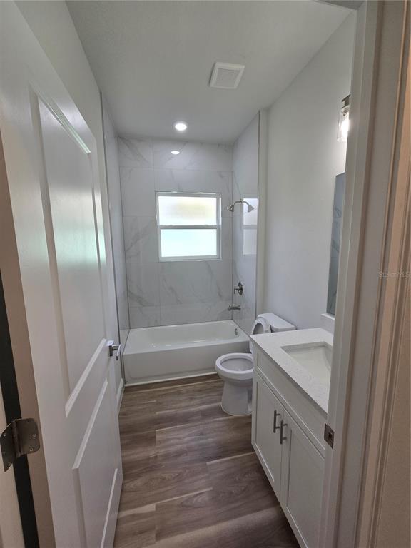 2717 Southwest 140th Loop Ocala, FL 34473 - Photo 29 of 40 a bathroom with a tub sink toilet and a mirror