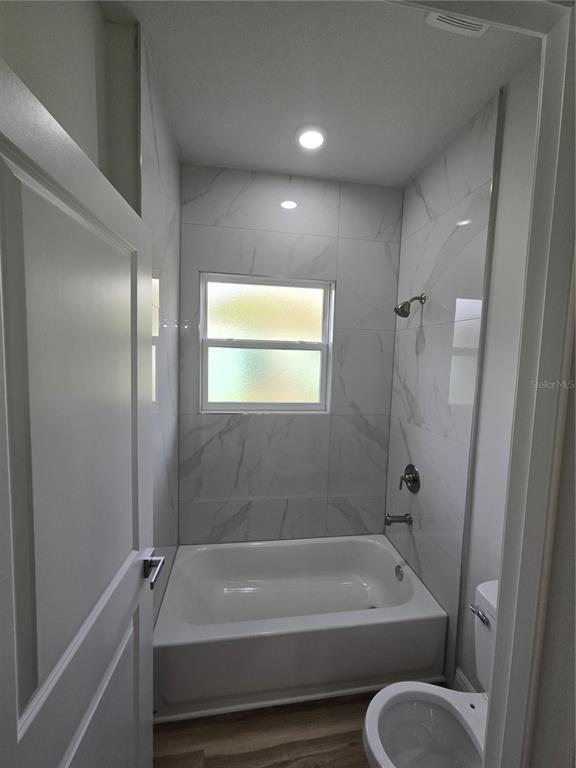 2717 Southwest 140th Loop Ocala, FL 34473 - Photo 31 of 40 a bathroom with a tub and a shower