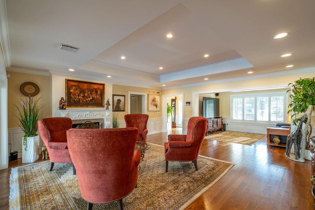 2317 Northeast 28th Court Lighthouse Point, FL 33064 - Photo 13 of 49 a living room with furniture a wooden floor and next to a window