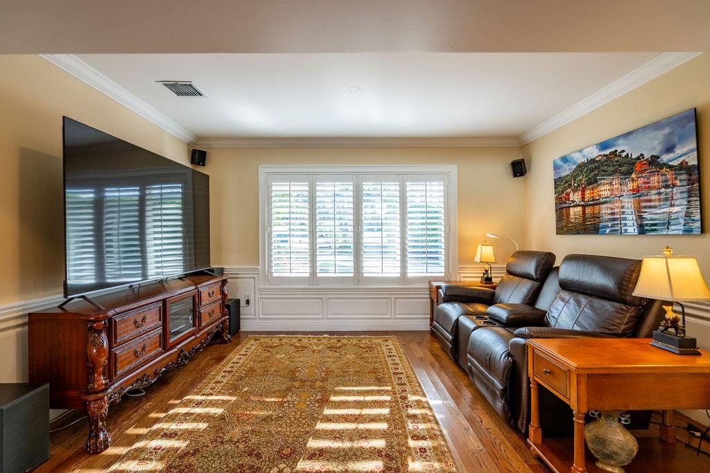2317 Northeast 28th Court Lighthouse Point, FL 33064 - Photo 15 of 49 a spacious bedroom with a bed and wooden floor