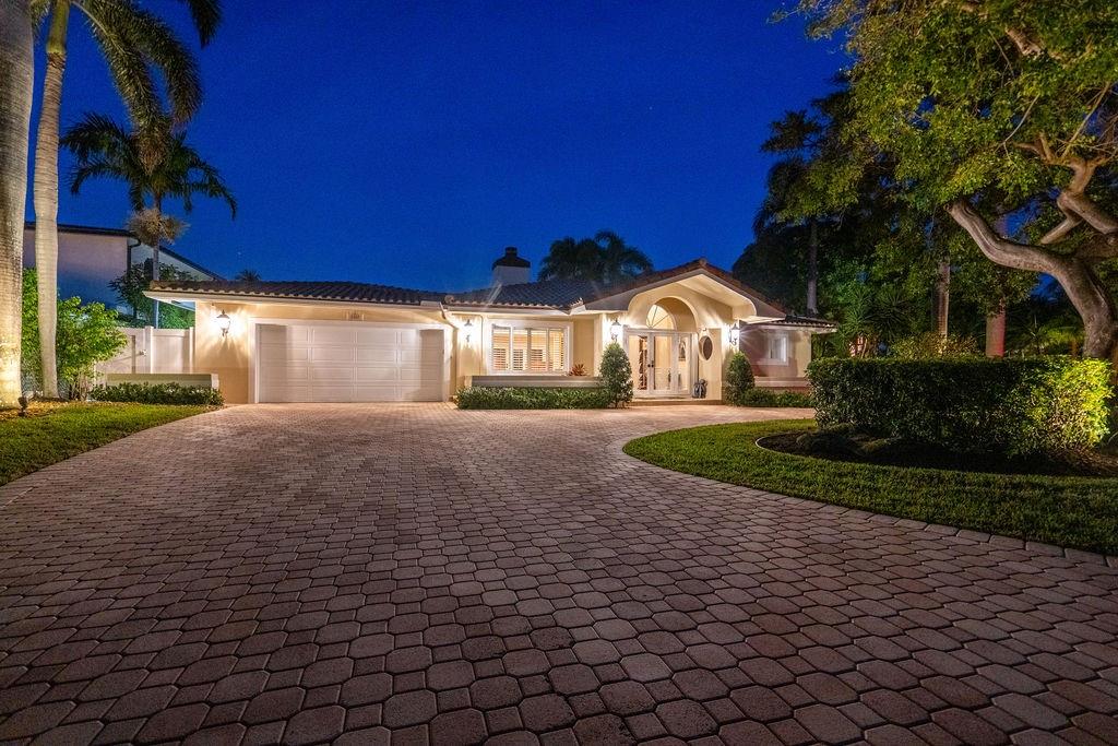 2317 Northeast 28th Court Lighthouse Point, FL 33064 - Photo 2 of 49 a view of a house with a yard