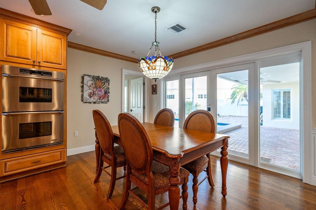 2317 Northeast 28th Court Lighthouse Point, FL 33064 - Photo 21 of 49 a dining room with furniture and window