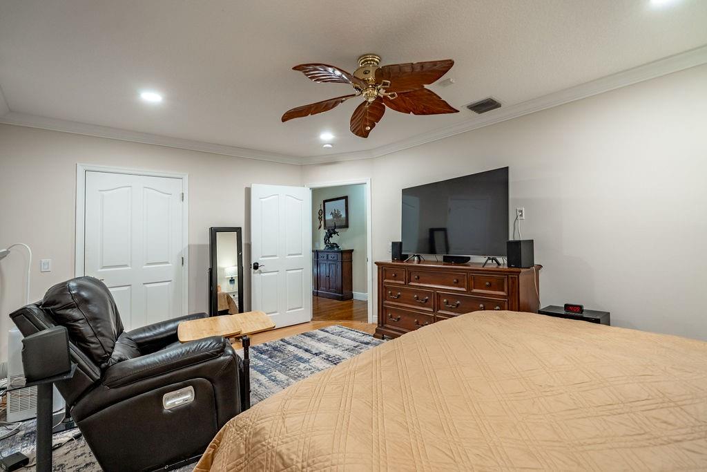 2317 Northeast 28th Court Lighthouse Point, FL 33064 - Photo 29 of 49 a bedroom with a bed and a flat screen tv