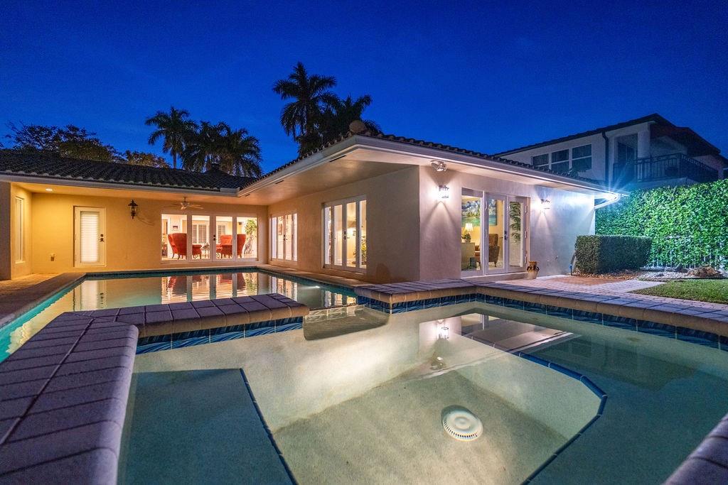 2317 Northeast 28th Court Lighthouse Point, FL 33064 - Photo 35 of 49 a view of swimming pool with seating area