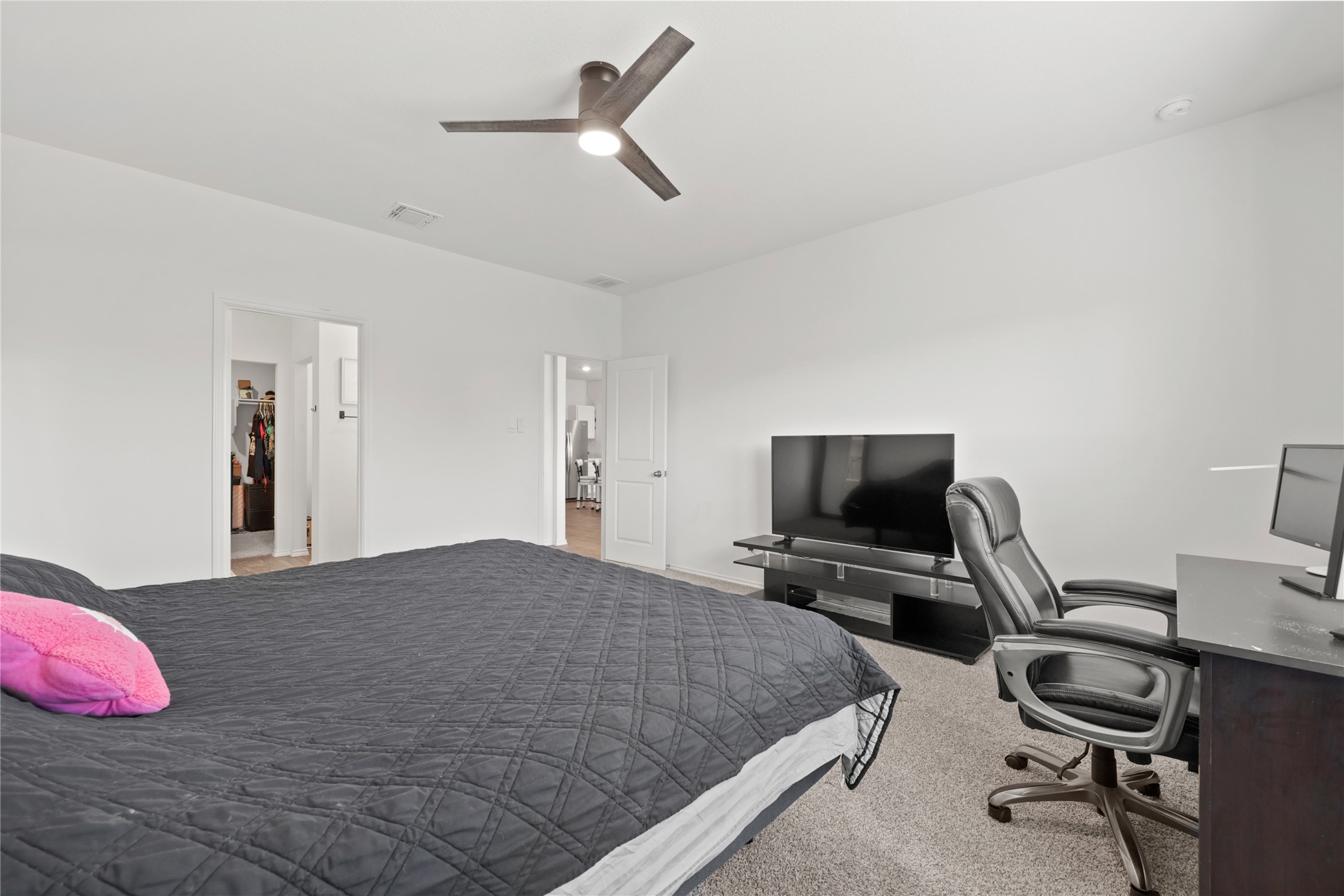790 Arnold Loop Kyle, TX 78640 - Photo 15 of 36 The ultimate primary suite! Experience total convenience with a bright, airy layout that flows seamlessly into your private ensuite bathroom and a huge walk-in closet for all your storage needs.
