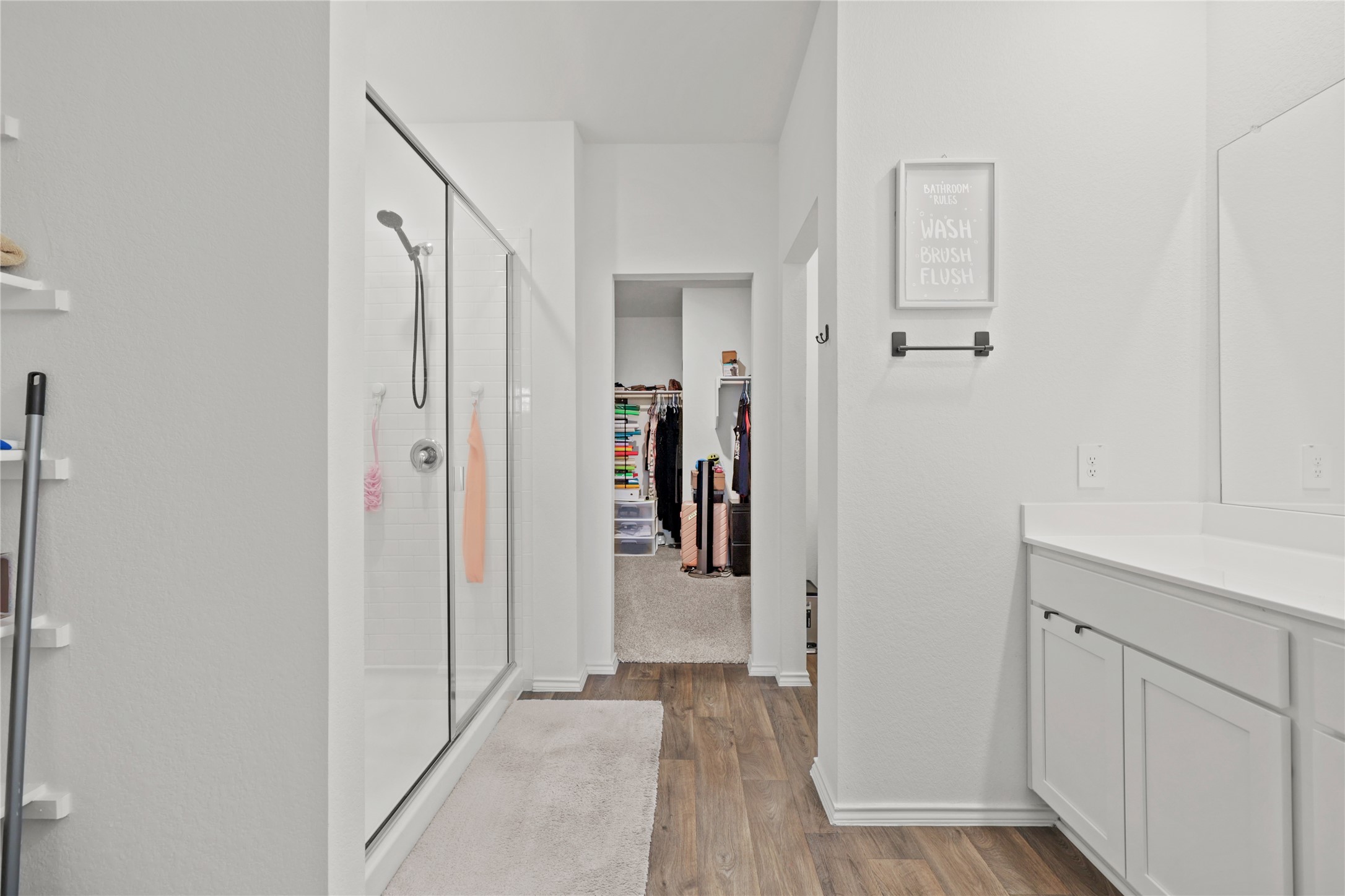 790 Arnold Loop Kyle, TX 78640 - Photo 18 of 36 Storage meets style! This beautifully appointed bathroom offers seamless access to a walk-in closet, ensuring all your wardrobe essentials are organized and right at your fingertips.
