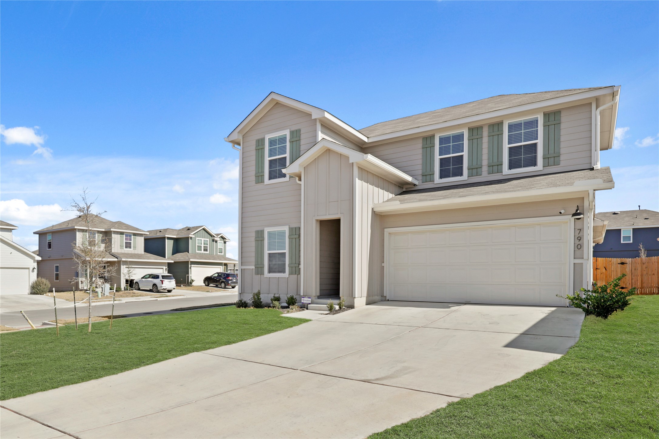 790 Arnold Loop Kyle, TX 78640 - Photo 2 of 36 Modern aesthetic meets suburban comfort in this stunning two-story beauty, featuring stylish decorative shutters and a crisp, inviting entryway.