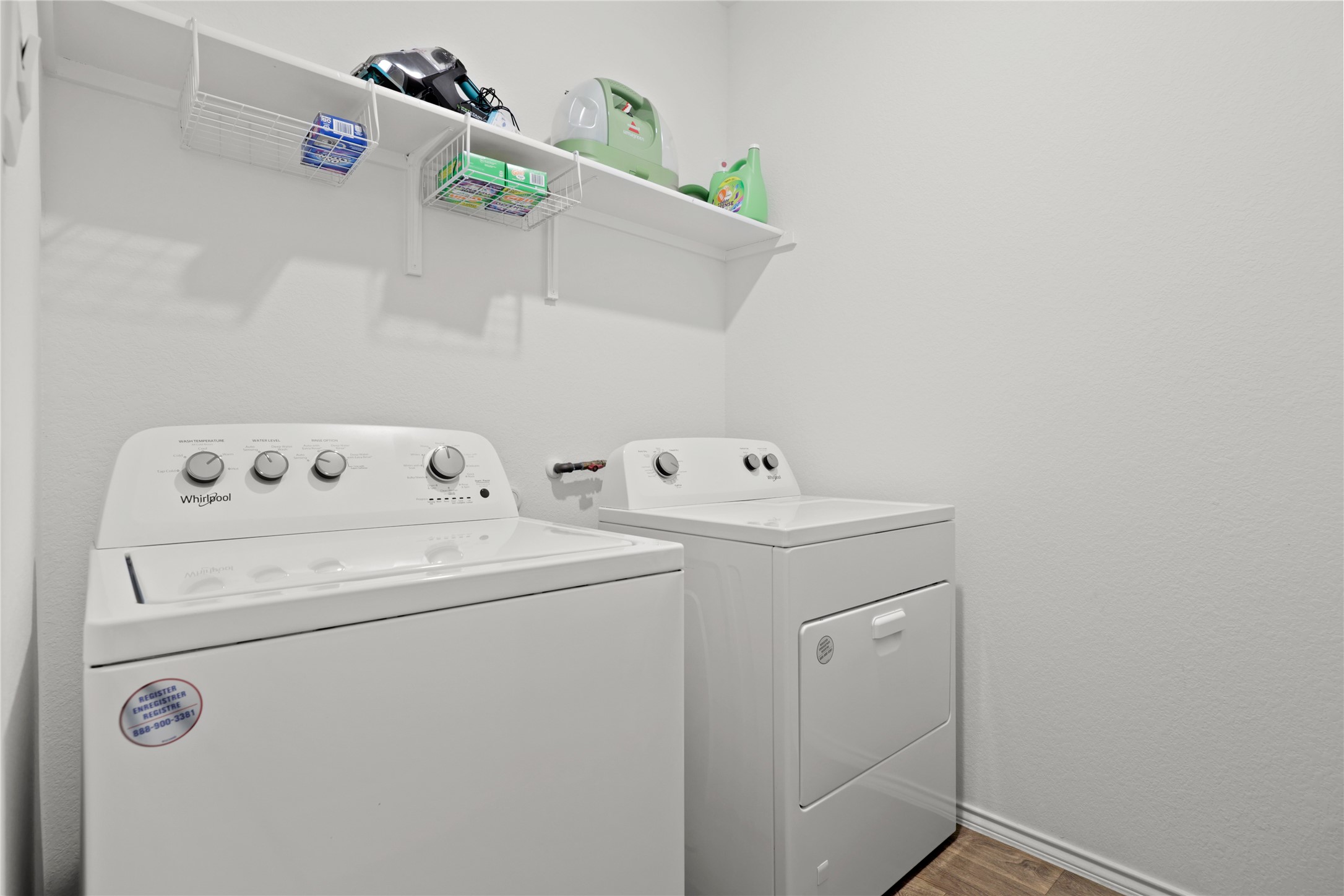 790 Arnold Loop Kyle, TX 78640 - Photo 21 of 36 Laundry area with independent washer and dryer and dark wood-style floors