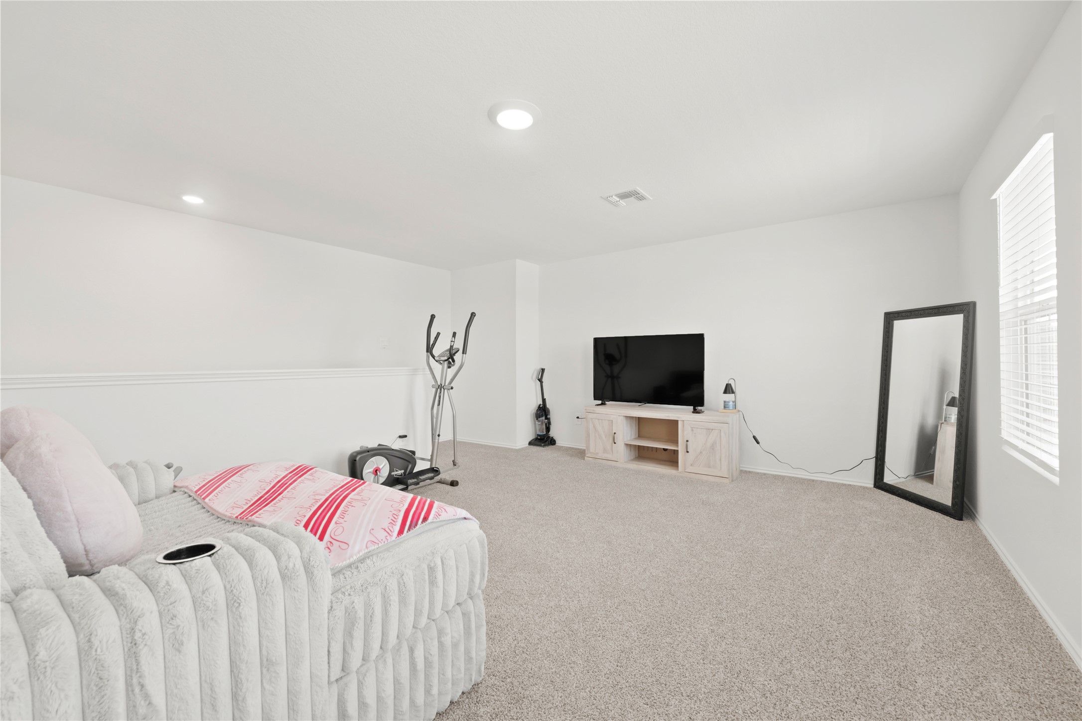 790 Arnold Loop Kyle, TX 78640 - Photo 23 of 36 Double the living potential! This expansive upstairs retreat offers a versatile second lounge area, perfect for movie nights, a gaming hub, or just extra room for the whole family to spread out.
