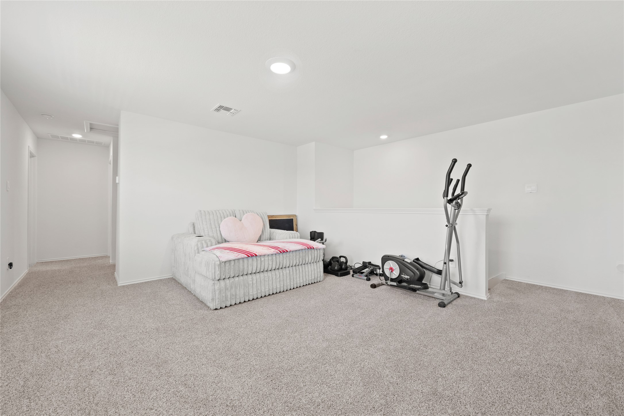 790 Arnold Loop Kyle, TX 78640 - Photo 24 of 36 The ultimate flex loft! Whether you need a high-energy home gym, a cozy reading den, or a dedicated play zone, this massive second living space handles your lifestyle with ease.