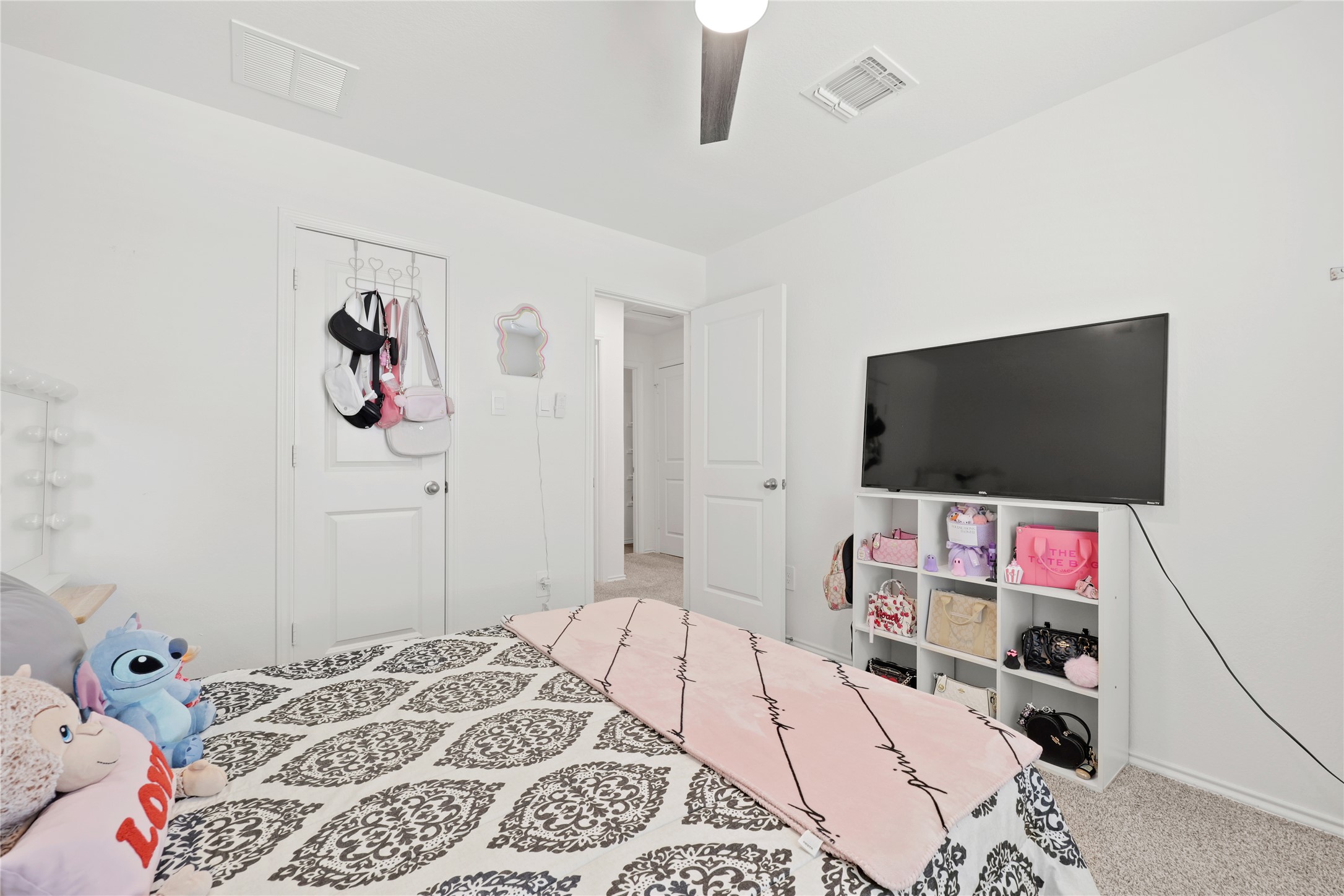 790 Arnold Loop Kyle, TX 78640 - Photo 26 of 36 Versatile and cozy, this secondary bedroom offers a perfect layout for a dedicated guest suite or home office, with neutral tones that complement any decor style.