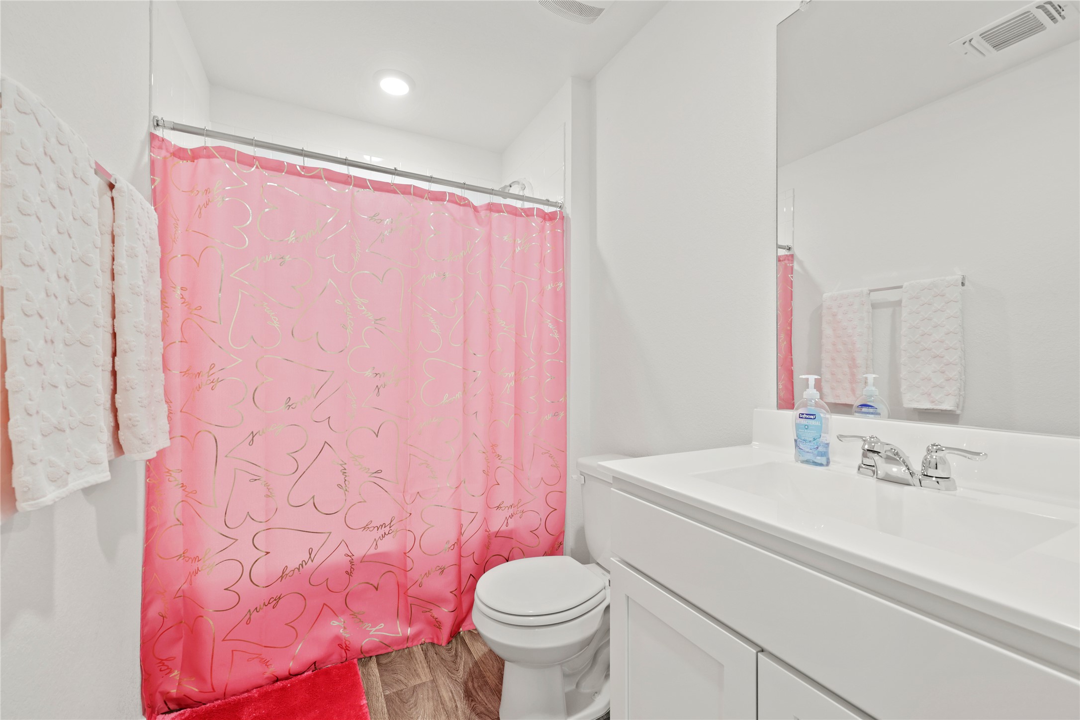 790 Arnold Loop Kyle, TX 78640 - Photo 27 of 36 Conveniently located for the secondary bedrooms, this clean, neutral bathroom offers plenty of space and a simple, modern design.