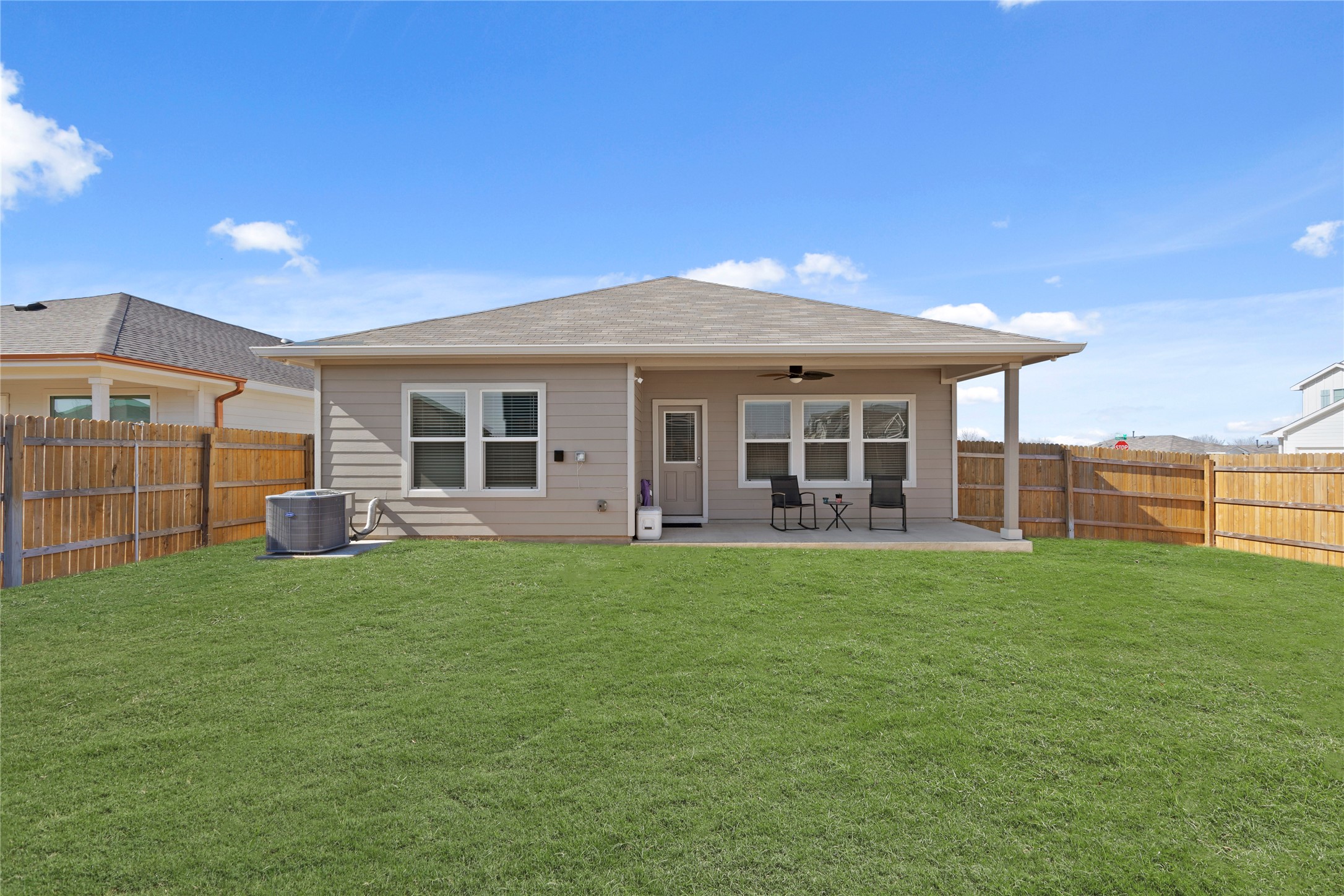 790 Arnold Loop Kyle, TX 78640 - Photo 31 of 36 Space to run and play! With its sprawling green lawn and open sky views, this oversized lot offers endless possibilities for gardening, outdoor games, or building your dream backyard retreat.