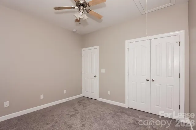 an empty room with fan