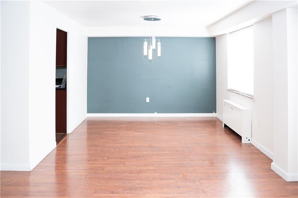 4625 Fifth Avenue, Unit 202 Pittsburgh, PA 15213 - Photo 14 of 28 a view of an empty room with wooden floor