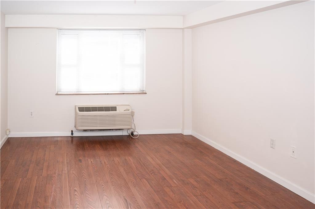 4625 Fifth Avenue, Unit 202 Pittsburgh, PA 15213 - Photo 15 of 28 a view of a room with wooden floor and white walls