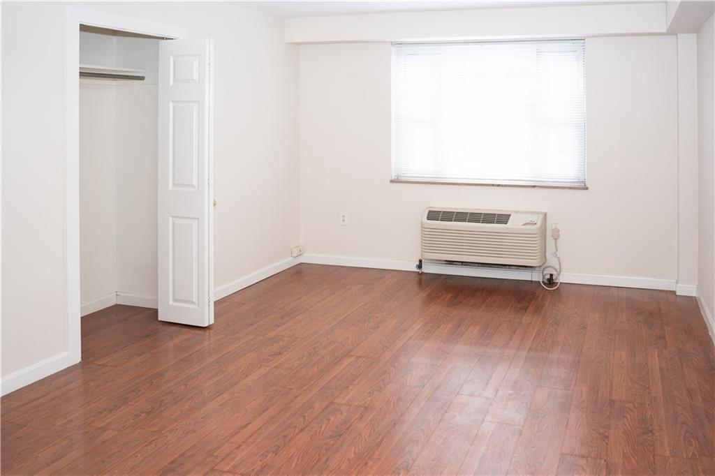 4625 Fifth Avenue, Unit 202 Pittsburgh, PA 15213 - Photo 18 of 28 a view of a room with wooden floor and cabinet