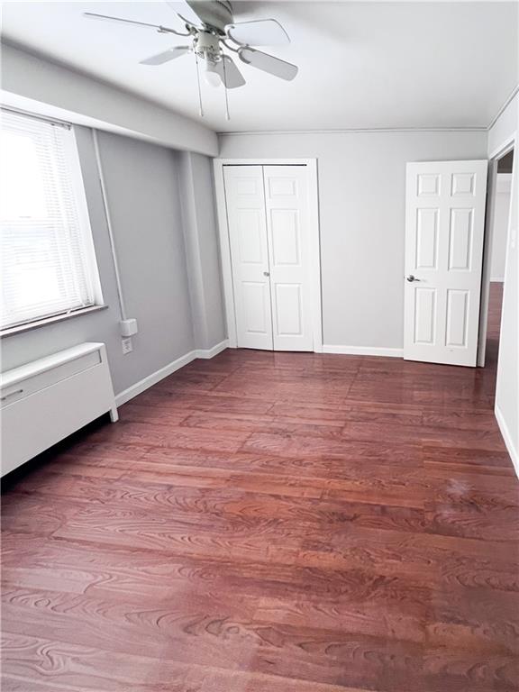 4625 Fifth Avenue, Unit 202 Pittsburgh, PA 15213 - Photo 21 of 28 a view of an empty room with wooden floor and window