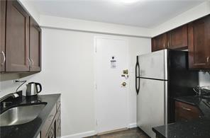 4625 Fifth Avenue, Unit 202 Pittsburgh, PA 15213 - Photo 9 of 28 a white refrigerator freezer sitting inside of a kitchen