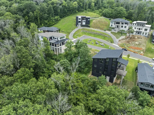 an aerial view of a house with a garden