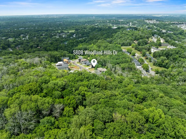 a view of a brick house with a large windows