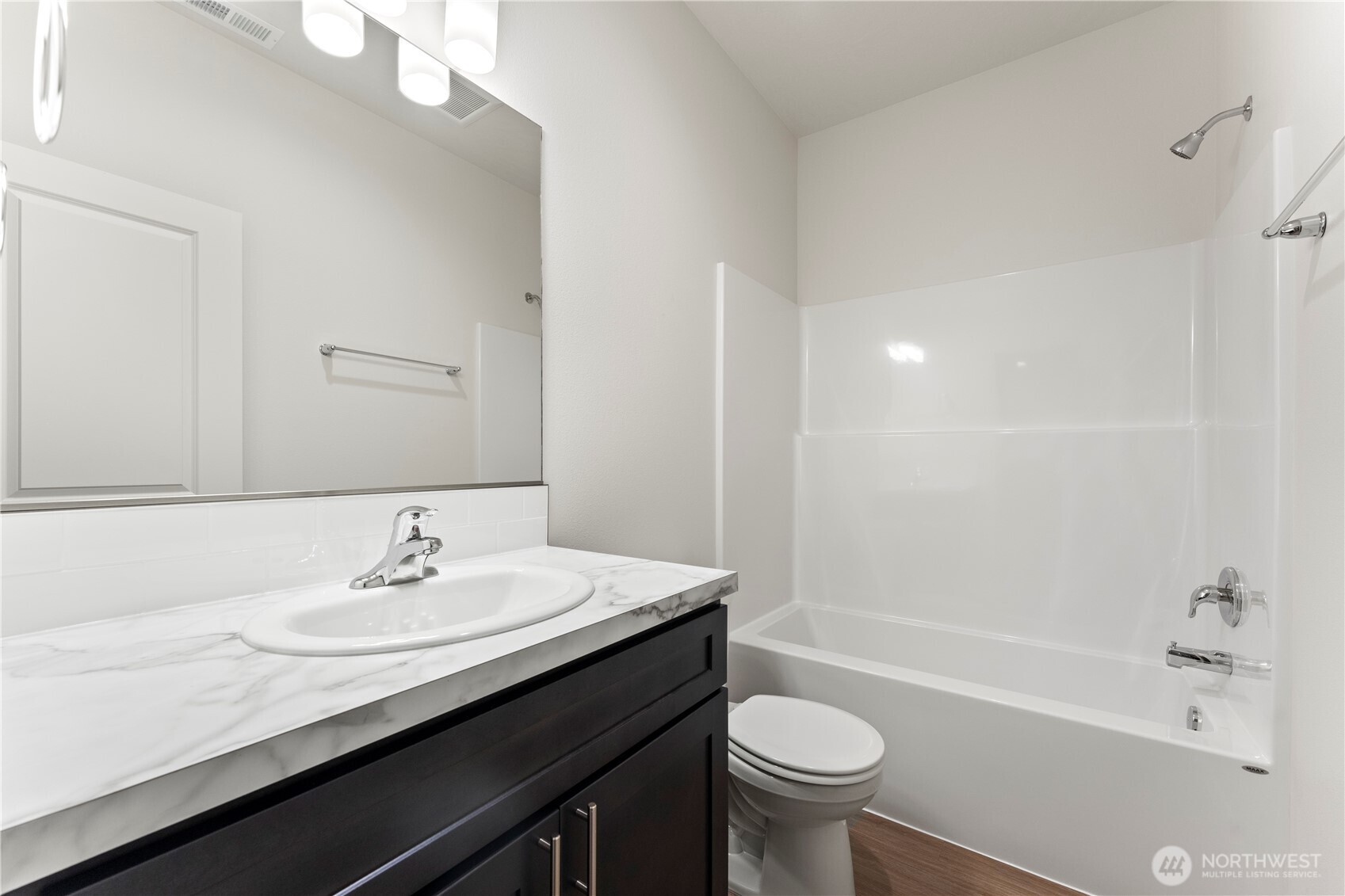 216 Rattray Drive Mattawa, WA 99349 - Photo 11 of 23 a bathroom with a sink a toilet a mirror a bathtub and shower