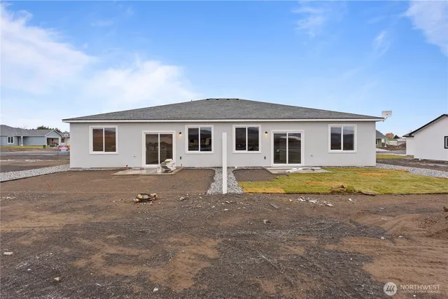 a house with swimming pool in front of it