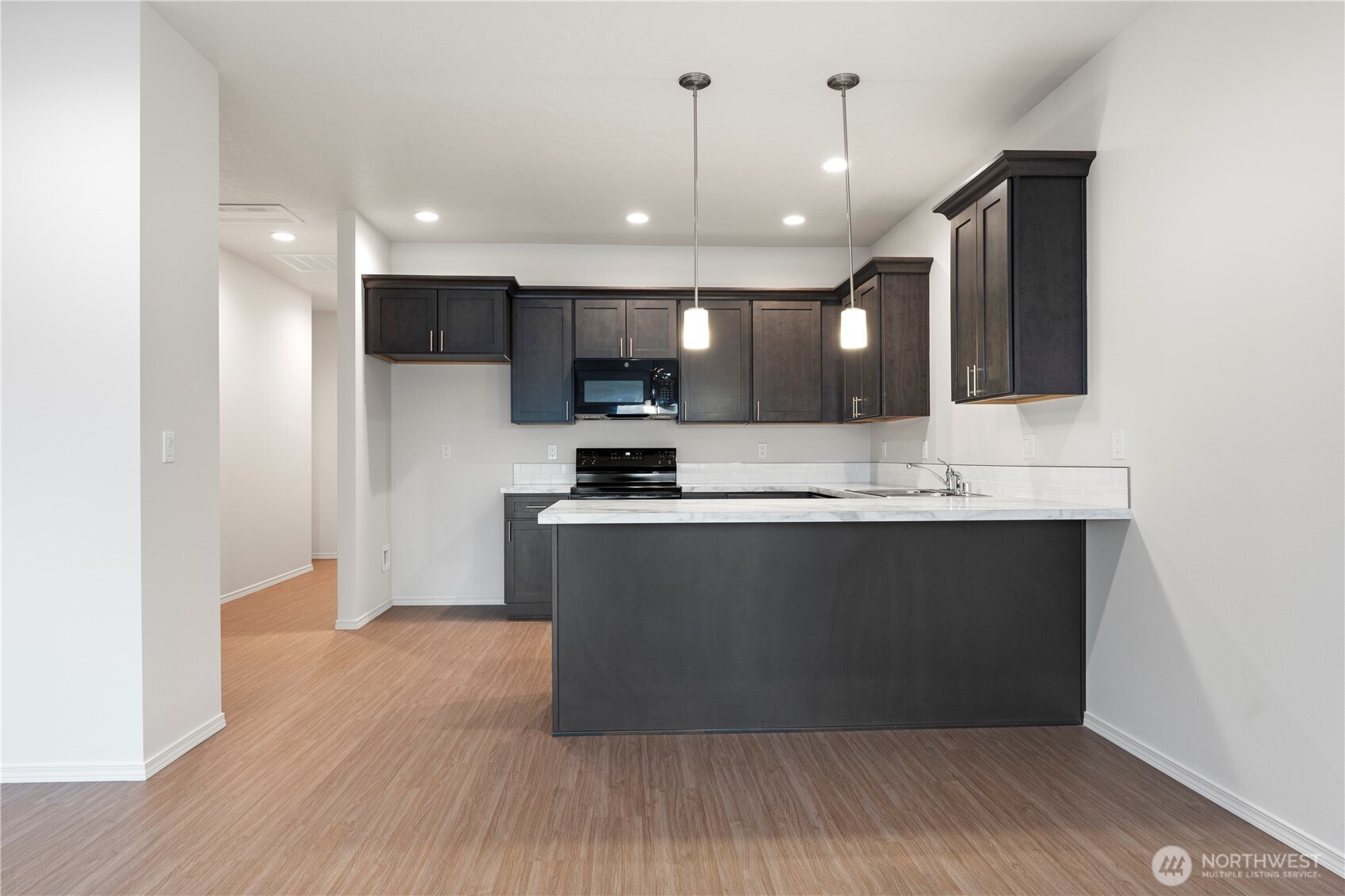 216 Rattray Drive Mattawa, WA 99349 - Photo 2 of 23 a view of kitchen with refrigerator microwave and stove