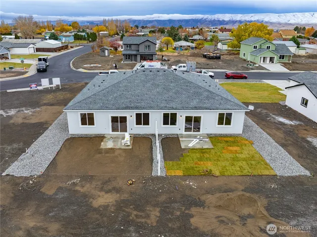 an aerial view of a house with swimming pool
