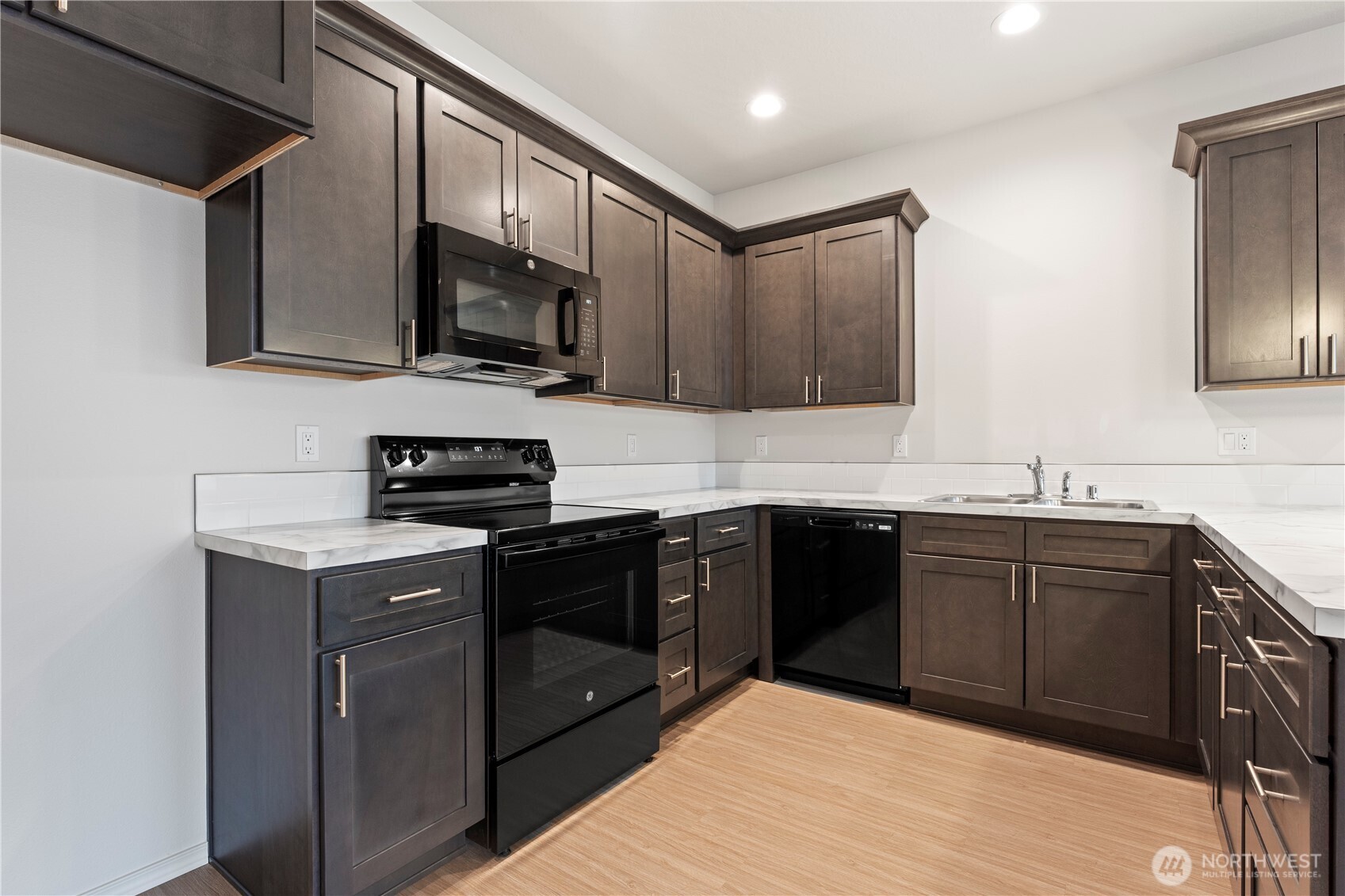 216 Rattray Drive Mattawa, WA 99349 - Photo 4 of 23 a kitchen with stainless steel appliances granite countertop wooden cabinets a stove top oven a sink and dishwasher