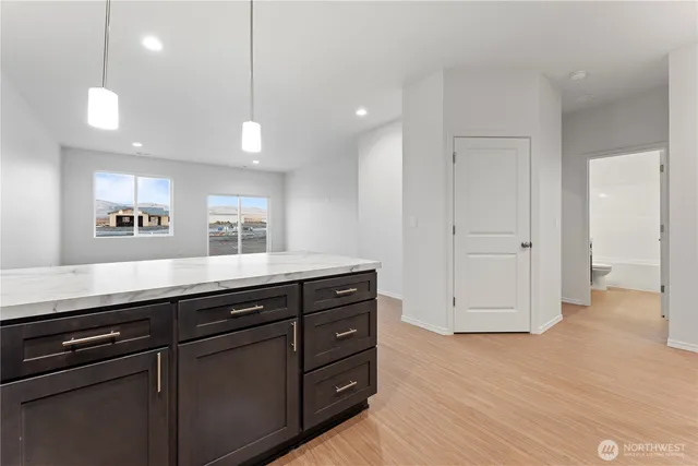 a spacious bathroom with a granite countertop sink