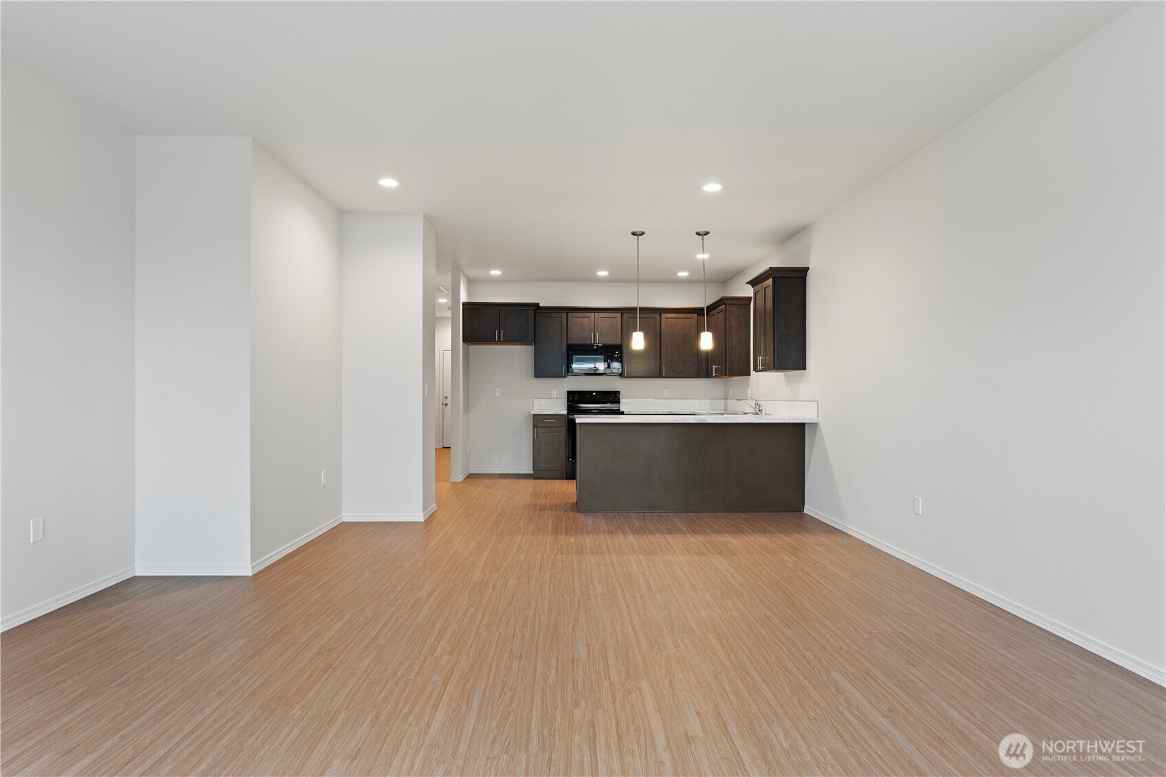 216 Rattray Drive Mattawa, WA 99349 - Photo 7 of 23 a view of kitchen with wooden floor