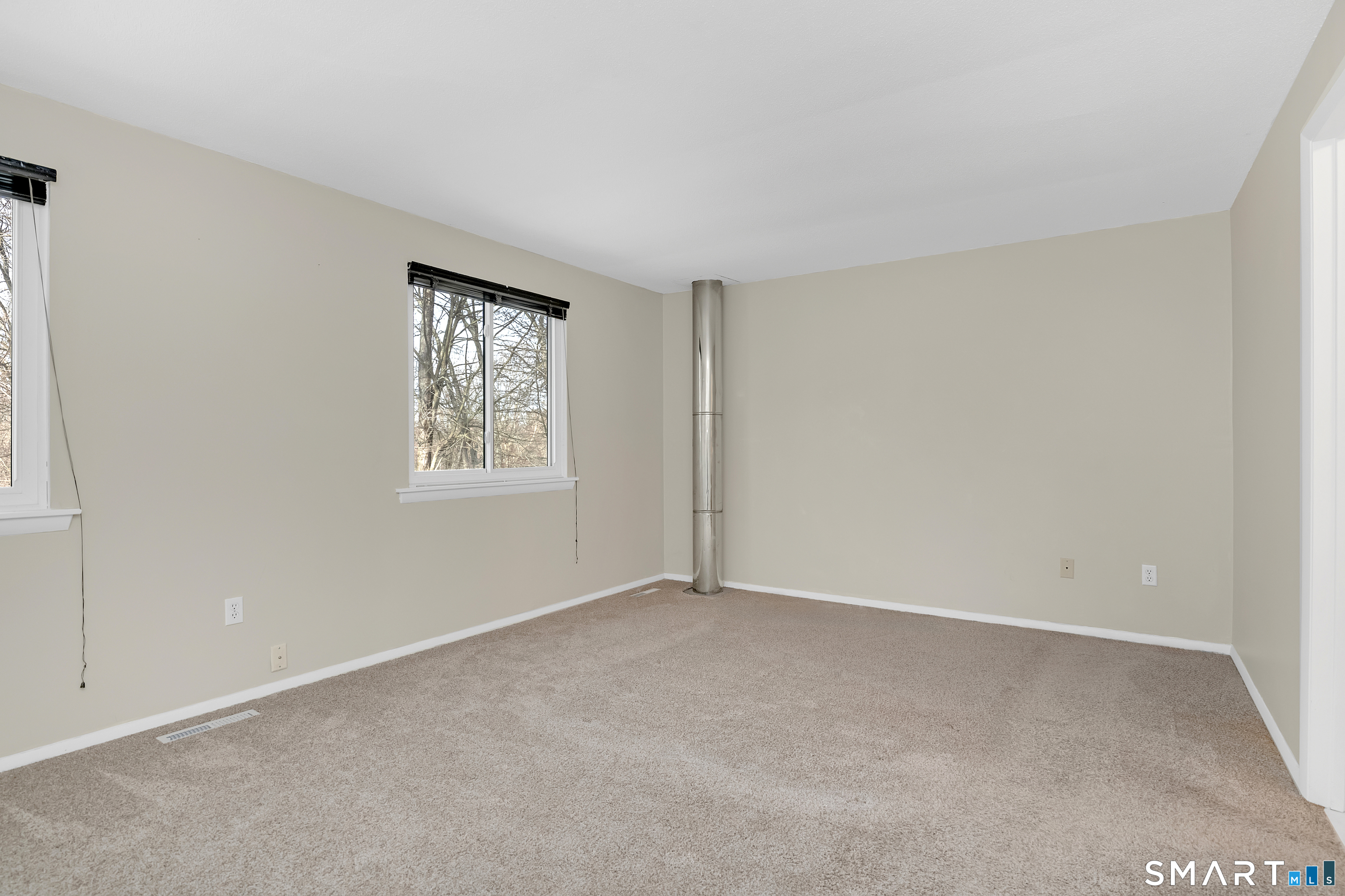 32 Conestoga Way, Unit 32 Glastonbury, CT 06033 - Photo 24 of 38 an empty room with windows