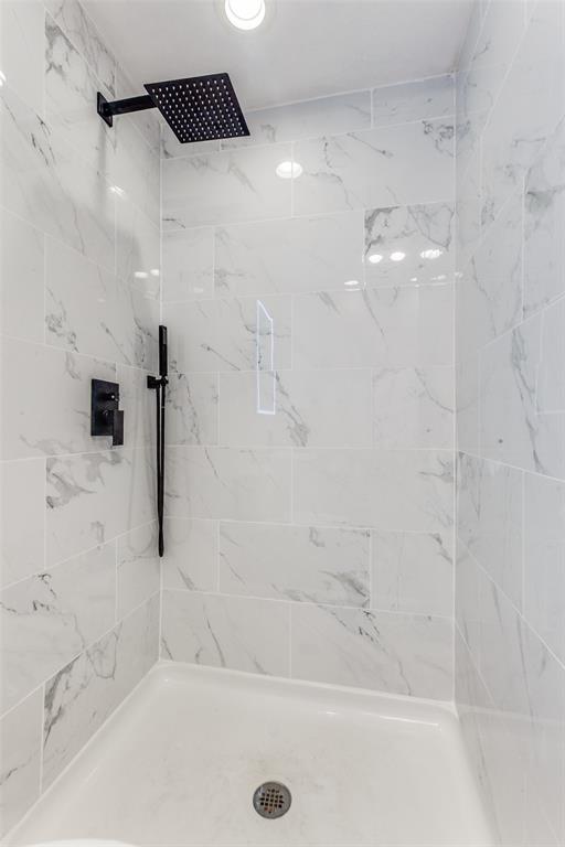 2718 Runningbrook Lane Dallas, TX 75228 - Photo 19 of 23 a bathroom with a bathtub and a shower