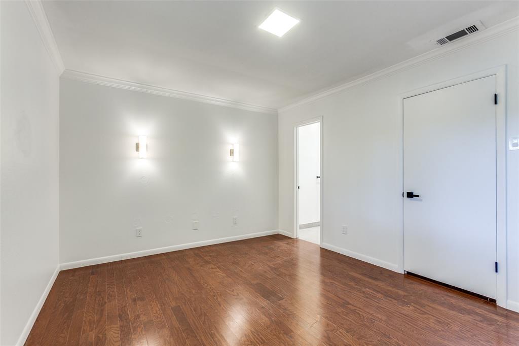 2718 Runningbrook Lane Dallas, TX 75228 - Photo 21 of 23 a view of an empty room with wooden floor and closet