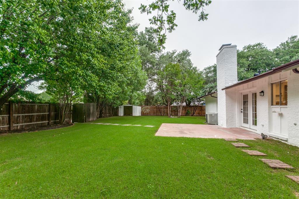 2718 Runningbrook Lane Dallas, TX 75228 - Photo 23 of 23 a view of a backyard with a house