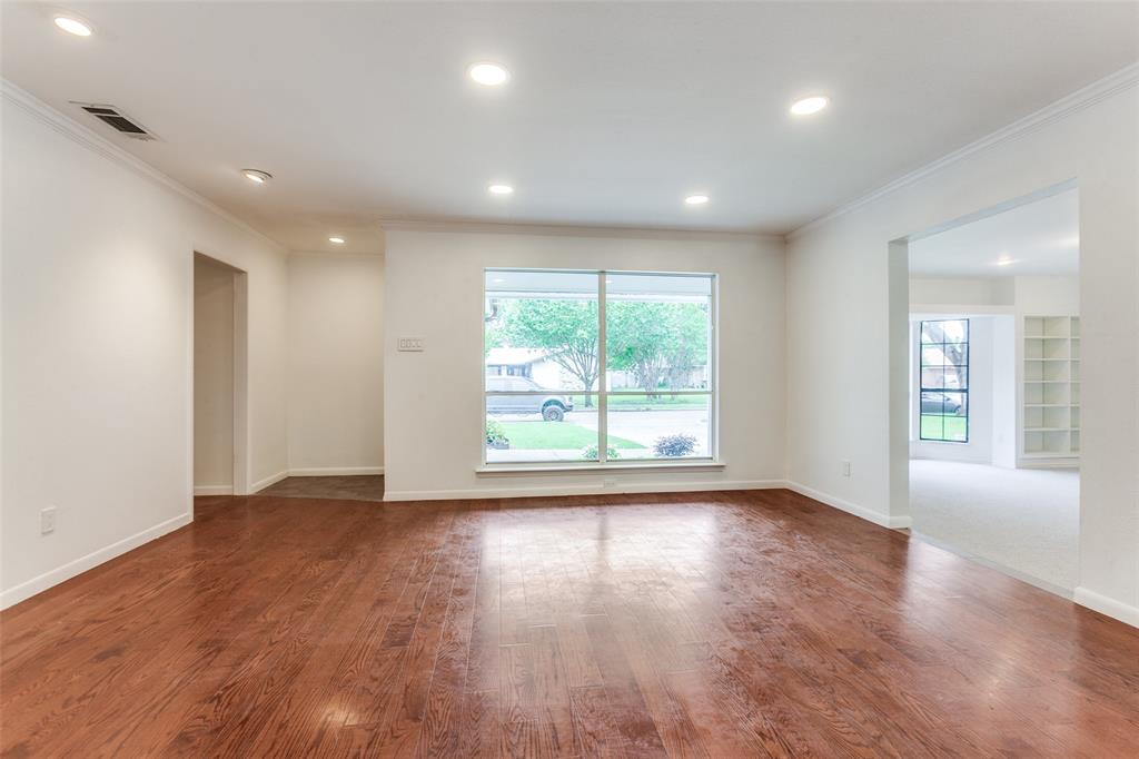 2718 Runningbrook Lane Dallas, TX 75228 - Photo 8 of 23 an empty room with wooden floor and windows