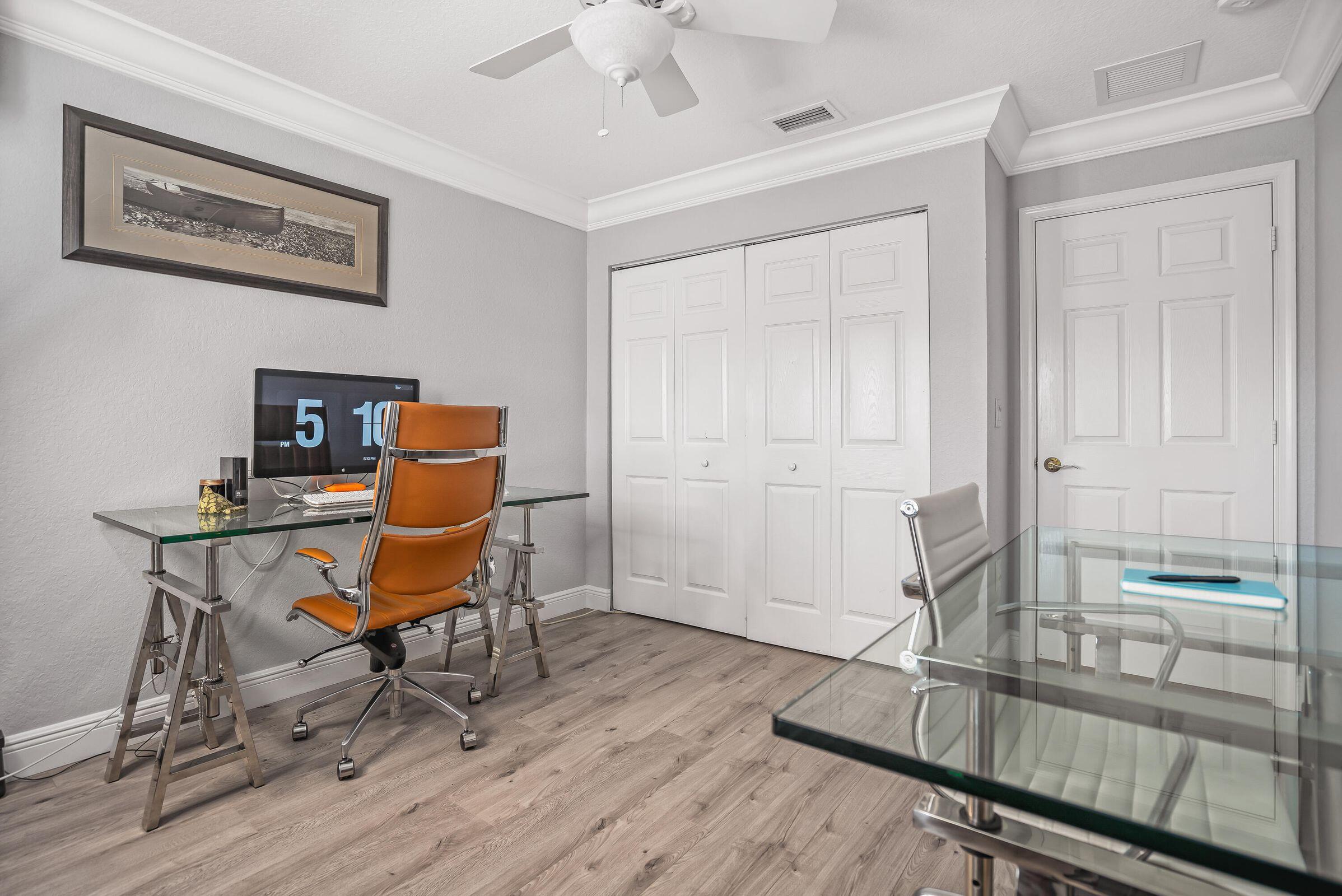 7559 Spatterdock Drive Boynton Beach, FL 33437 - Photo 14 of 33 a workspace room with furniture and wooden floor