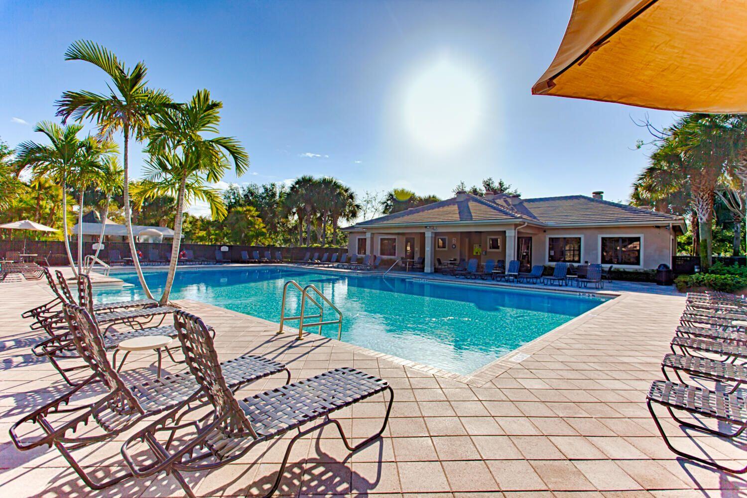 7559 Spatterdock Drive Boynton Beach, FL 33437 - Photo 25 of 33 a view of house with swimming pool outdoor seating
