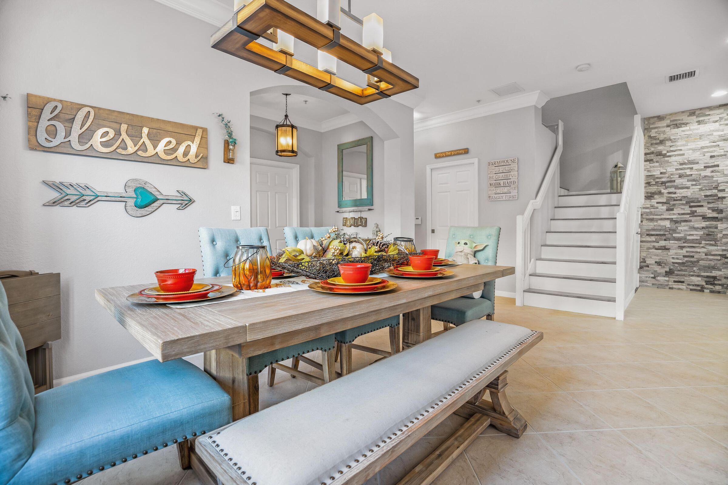 7559 Spatterdock Drive Boynton Beach, FL 33437 - Photo 4 of 33 a view of a dining room with furniture and a potted plant
