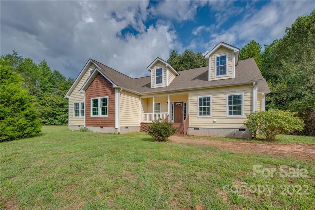 6410 Big Level Road Mill Spring, NC 28756 - Photo 1 of 32 a front view of a house with a yard