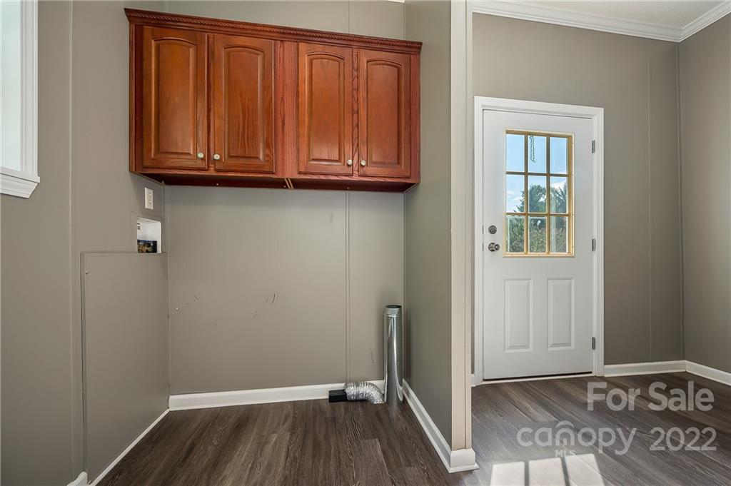 6410 Big Level Road Mill Spring, NC 28756 - Photo 13 of 32 a view of a room with wooden floor and closet
