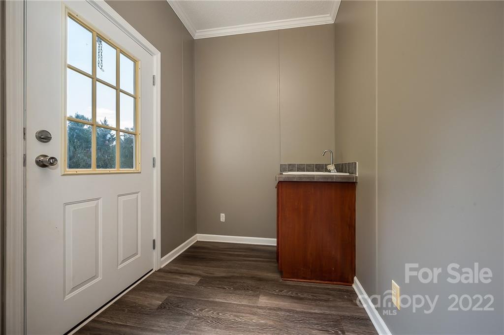 6410 Big Level Road Mill Spring, NC 28756 - Photo 14 of 32 an empty room with windows