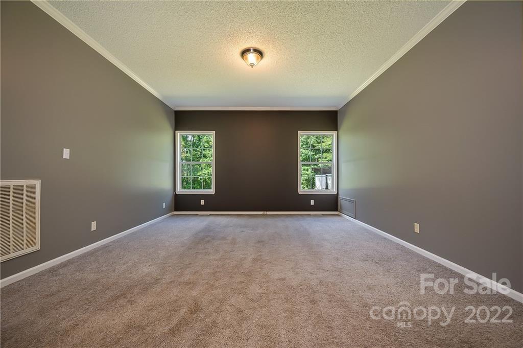 6410 Big Level Road Mill Spring, NC 28756 - Photo 18 of 32 an empty room with windows