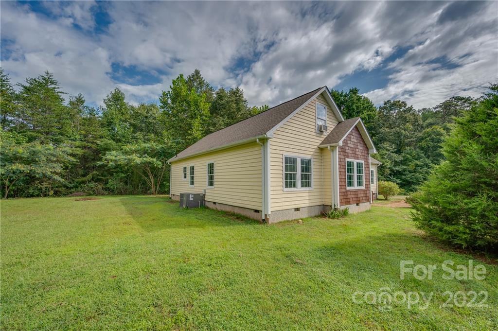 6410 Big Level Road Mill Spring, NC 28756 - Photo 2 of 32 a view of a house with a yard