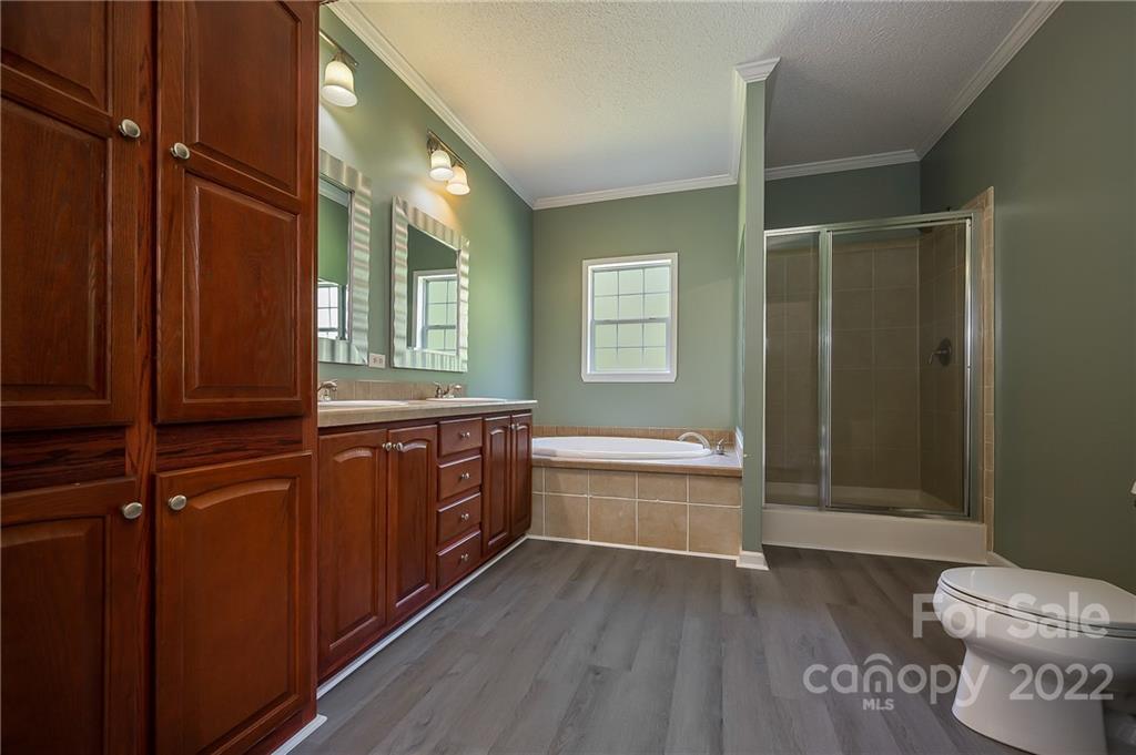 6410 Big Level Road Mill Spring, NC 28756 - Photo 23 of 32 a bathroom with a granite countertop sink toilet and shower