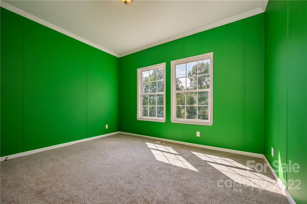 6410 Big Level Road Mill Spring, NC 28756 - Photo 26 of 32 a view of a room with window and a projector