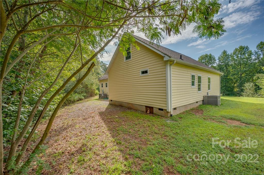 6410 Big Level Road Mill Spring, NC 28756 - Photo 30 of 32 a view of a house with a yard
